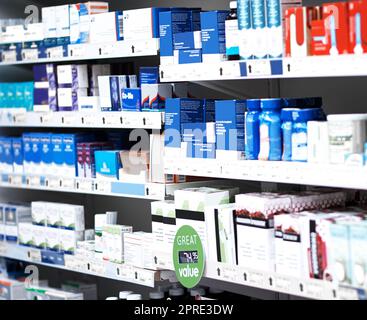 There are various brands to help beat your symptoms. shelves stocked with various medicinal products in a pharmacy. Stock Photo