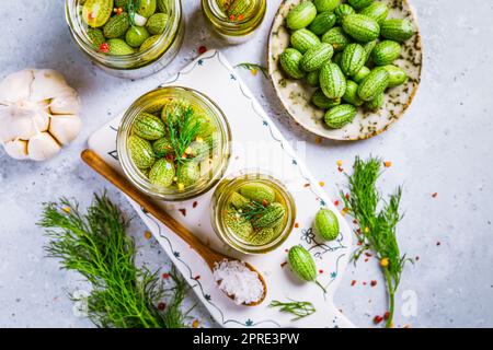Homemade food: Pickled cucamelons (pickled cucumbers, pickled gherkins), grown in a organic kitchen Stock Photo