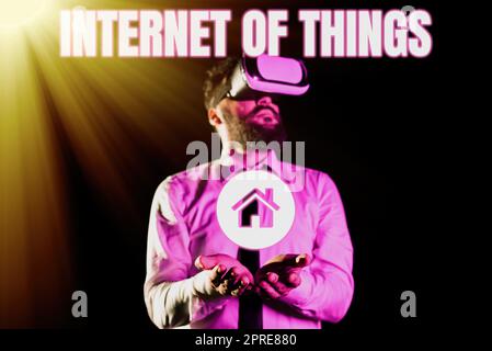 Hand writing sign Internet Of Thingsconnection of Devices to the Net to Send Receive Data, Concept meaning connection of Devices to the Net to Send Re Stock Photo