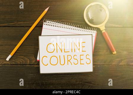 Text sign showing Online Courses, Word for earning an education that is conducted over the Internet Stock Photo