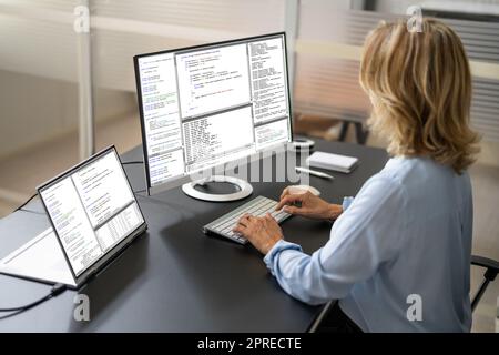 Software Programmer Or Coder Woman Using Office Computer Stock Photo
