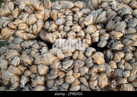 thick brown bundle of raw jute fiber Texture Background Stock Photo