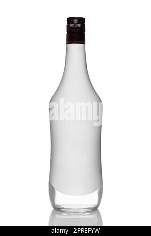 Bottle of alcohol beverage with coconut flavour with reflection on white background. Stock Photo