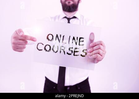 Writing displaying text Online Courses, Business idea earning an education that is conducted over the Internet Stock Photo