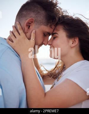 Couple, love and happy together on adventure and bonding in romantic holiday during summer. Real young man and woman hugging, peace and intimacy, stro Stock Photo