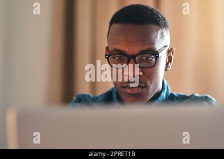 Freelance web designer with laptop thinking of website ideas, planning webpage and coding on technology while working from home. Serious, ambitious or inspired entrepreneur designing vision into code Stock Photo