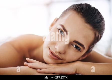 Im just taking it all in. Portrait of an attractive young woman getting pampered at a beauty spa. Stock Photo