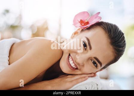 I never knew I needed it so much. Portrait of an attractive young woman getting pampered at a beauty spa. Stock Photo