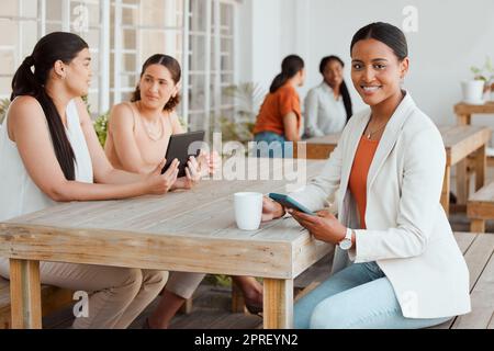 Business woman in office cafeteria or canteen texting, browsing and scrolling on phone during coffee break in creative startup agency. Portrait of smiling, happy and trendy designer on social media Stock Photo