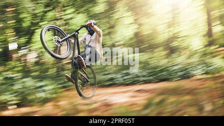 Cycling jump and fast with man in nature for adventure fitness