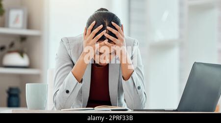 Headache, stress and worried young businesswoman tired from getting bad news about company investment. Professional finance, business female or accountant upset over financial problem or crisis. Stock Photo