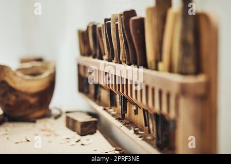 Whittling awayWoodwork is the best work. the inside of a craftsmans workshop. Stock Photo