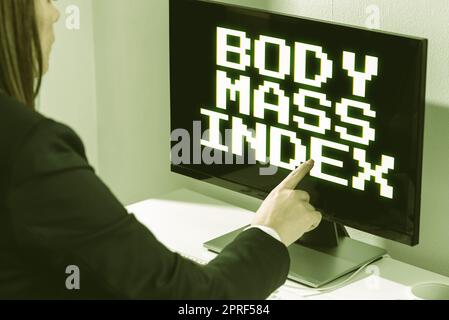 Inspiration showing sign Body Mass Index. Conceptual photo Value derived from the weight and height of an individual Businesswoman Pointing Important Infortmation With One Finger On Computer. Stock Photo