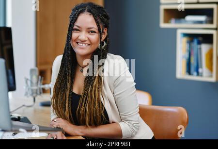 Im my own boss. Cropped portrait of an attractive young woman sitting in her home office. Stock Photo