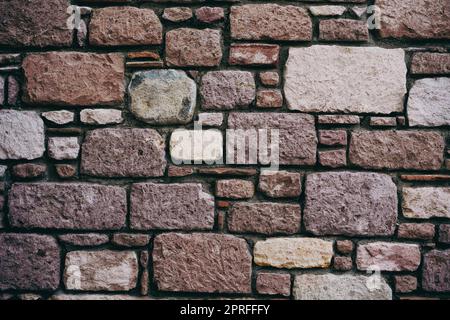 Vertical shot of stone tiles wall, background, texture, pattern. Stock Photo