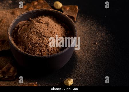 Сocoa powder  and chocolate nuts pieces Stock Photo