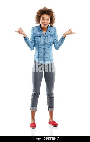 Stay inspired so you can inspire others. Studio shot of an attractive young woman pointing in two different directions. Stock Photo