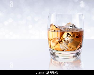 Whiskey with ice in a glass on white shining bokeh background. 3d render Stock Photo