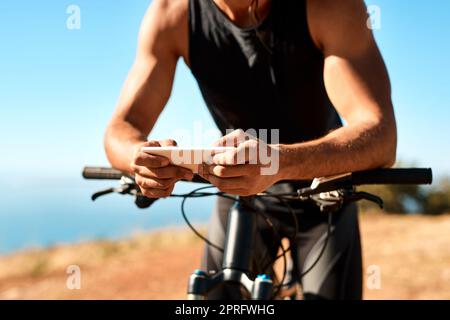 If youre passionate about something, why not write about it. an unrecognizable man using his cellphone while out for a ride on his mountain bike. Stock Photo