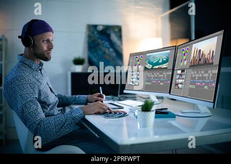 Graphic Designer Working Late At Night Stock Photo