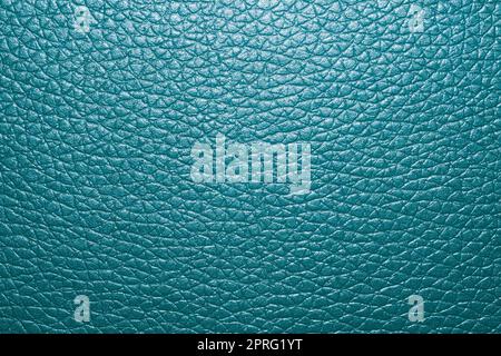 Blue colored leather surface background close up Stock Photo