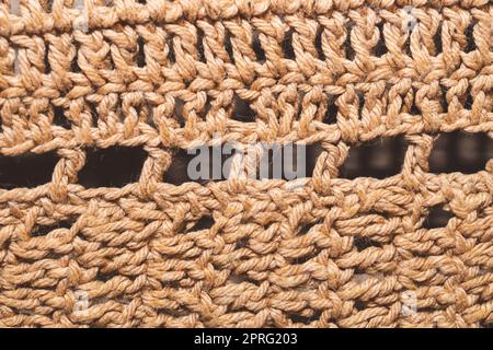 Knitted background from jute threads. weaving texture. woven backdrop close up Stock Photo