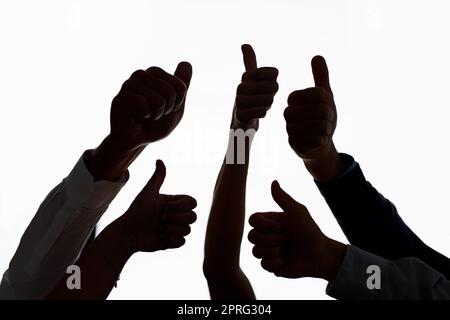 Bravo to you. a group of people showing thumbs up against a white background. Stock Photo
