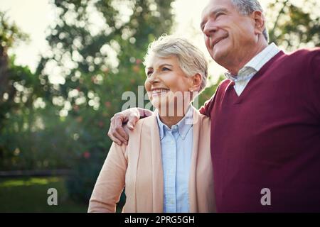 This is what happiness looks like. an affectionate senior couple enjoying some time outside. Stock Photo
