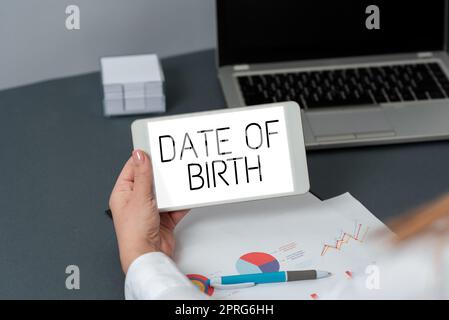 Writing displaying text Date Of Birth. Business overview Day when someone is born new baby coming pregnant lady Three Business People Presenting Important Informations In Frame. Stock Photo