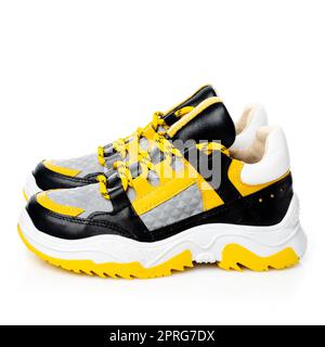 Close up of stylish trendy children's sneakers isolated on white background. Stock Photo