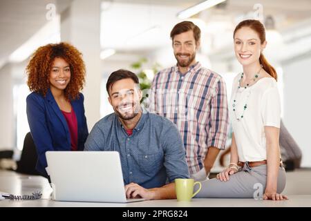 Give clients a reason to choose your services. Portrait of a group of colleagues working together in an office. Stock Photo