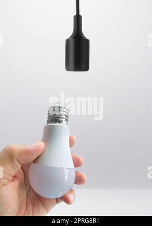 Power save LED lamp changing Stock Photo