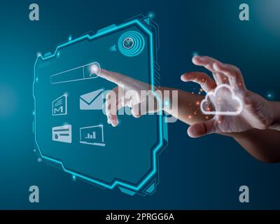 Finger pointing at the hologram screen Represents search, communication, storage with cloud computing. Stock Photo