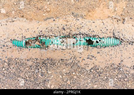 Cemented and damaged electrical cable channel. Stock Photo