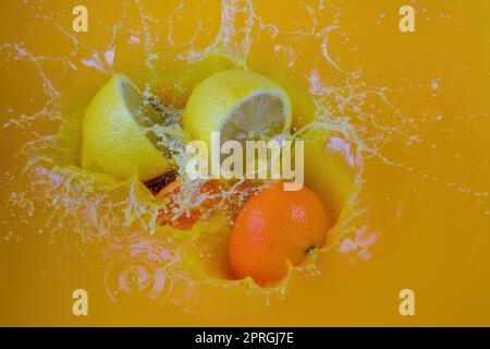 orange juice lemon splash fruit drink citrus splashing juicy tropical drops Stock Photo