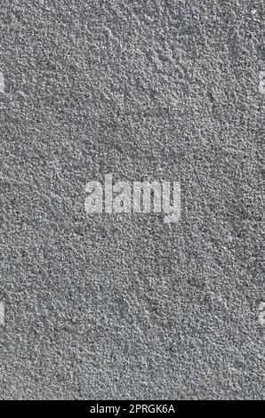 Texture of rough concrete wall with embossed texture. Smooth gray surface Stock Photo