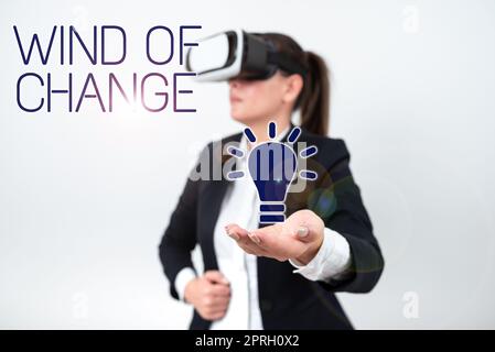 Handwriting text Wind Of Change. Concept meaning Changing time growing up doing things in a different way Businesswoman Holding Tablet With Important Informations On It. Stock Photo