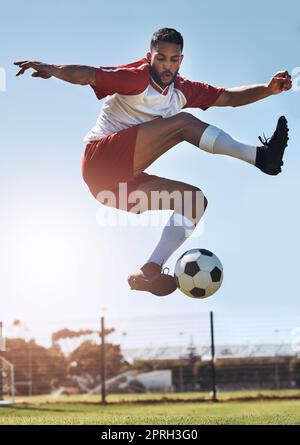 Soccer kick trick, football and man athlete from Israel on a sport field outdoor with motivation. Fitness, exercise and training workout of a person r Stock Photo