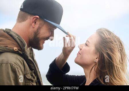 You should tip your hat to a lady. an affectionate young couple spending time together outdoors. Stock Photo