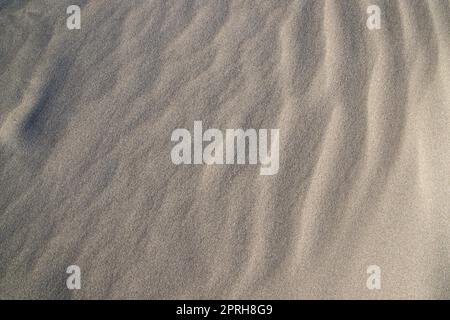 sand texture. wavy sand textured background. sand textured beach Stock Photo