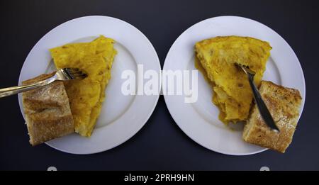Detail of typical Spanish lunch, food with potatoes and eggs Stock Photo