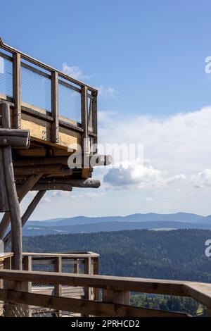 Observation tower located at the top of the Słotwiny Arena ski station, leading in the treetops, beautiful panorama of the mountain peaks, Krynica Zdroj, Beskid Mountains, Slotwiny, Poland Stock Photo