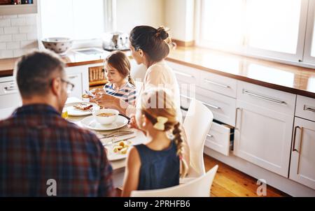 We all like different things for breakfast. a family enjoying breakfast together. Stock Photo