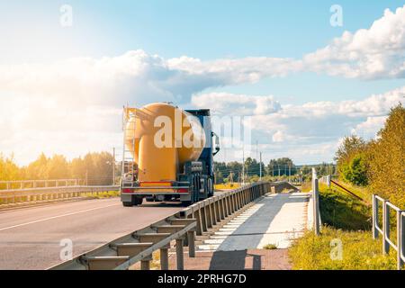 Big yellow truck tank on the roads of Europe Stock Photo