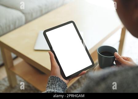 close-up women using digital tablet white screen in living room Stock Photo