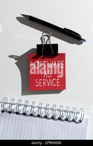 Hand writing sign Software As Service. Word Written on On Demand licensed on Subscription and centrally hosted Stock Photo