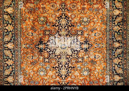 Red Oriental Indian Carpet Texture Background. Stock Photo