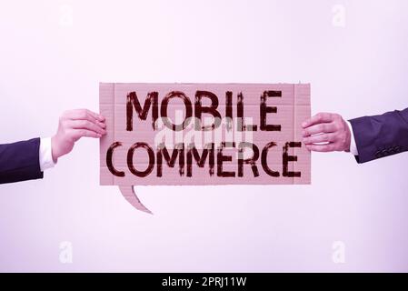 Writing displaying text Mobile CommerceUsing mobile phone to conduct commercial transactions online. Word Written on Using mobile phone to conduct commercial transactions online Stock Photo