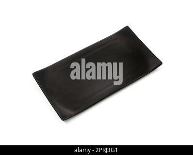 Empty black rectangle ceramic plate with rough texture, isolated on white background with clipping path, Top view Stock Photo