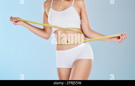 https://l450v.alamy.com/450v/2prj55w/health-diet-and-body-of-woman-with-tape-measure-to-track-progress-check-fitness-results-and-measure-waist-stomach-or-abdomen-weight-loss-motivatio-2prj55w.jpg
